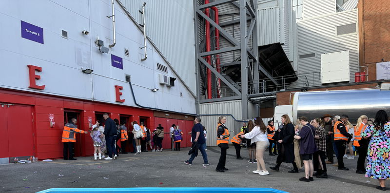 fans entering turnstiles for concert at anfield